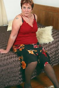 an aged girl with a large fat beneath is having some wet arse splooge on